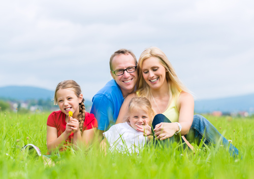 family-resting-on-grass_33399819.jpg